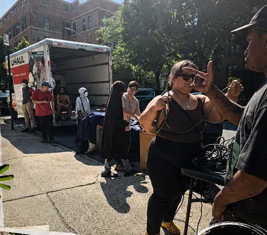 A Repurposed Life furniture pickup with a moving truck and community members working together